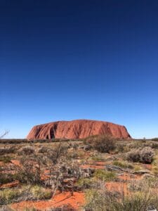 "Uluru at sunset, a striking red sandstone monolith in the heart of the Australian Outback, by Europa Travel Hub"