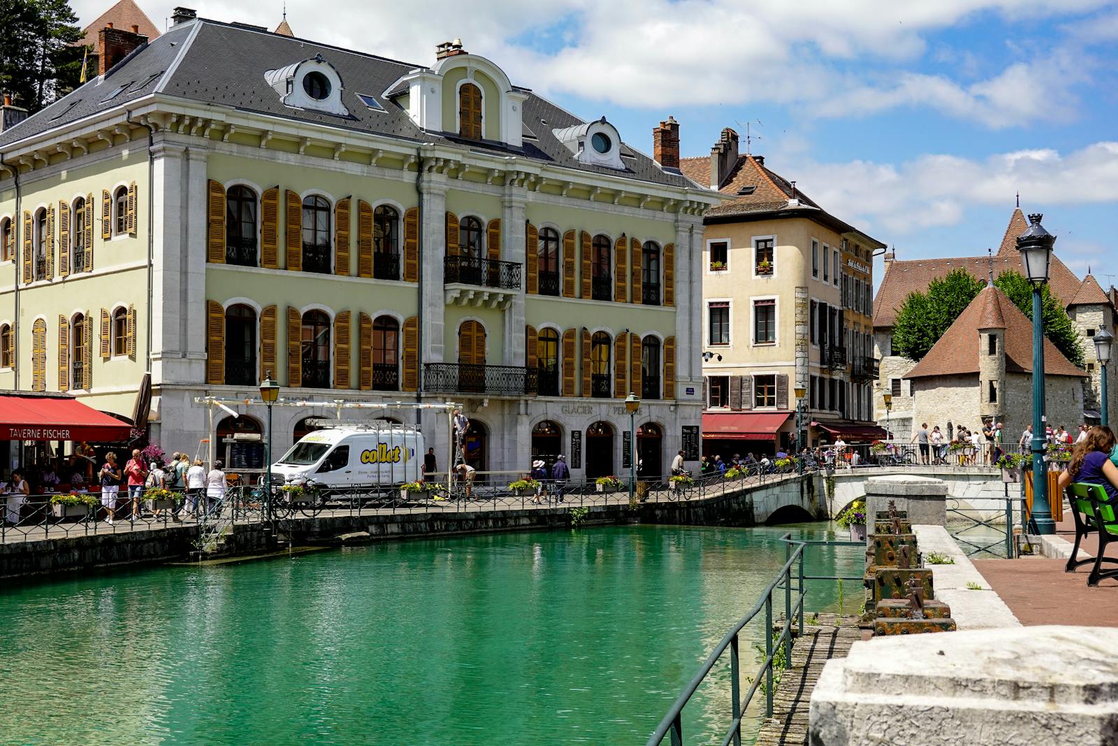 Scenic view of Annecy's historic cityscape featuring charming canals and classic European architecture.