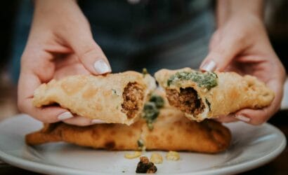 "Classic Australian meat pie filled with savory minced beef, gravy, and vegetables, recommended by Europa Travel Hub."