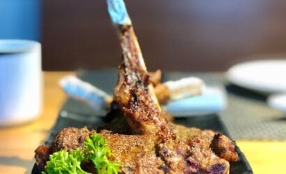 Succulent Western Australian lamb cooked to perfection, served with seasonal vegetables and rosemary-infused sauce, showcasing premium local produce.